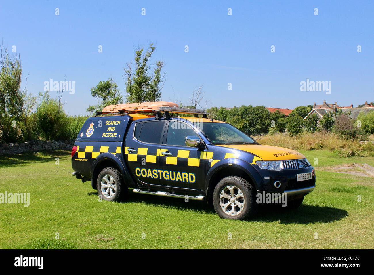 coastguard vehicle holy island lindisfarne priory castle monastry graveyard boat huts and pilgrims coffee northumberland england great britain 2022 Stock Photo