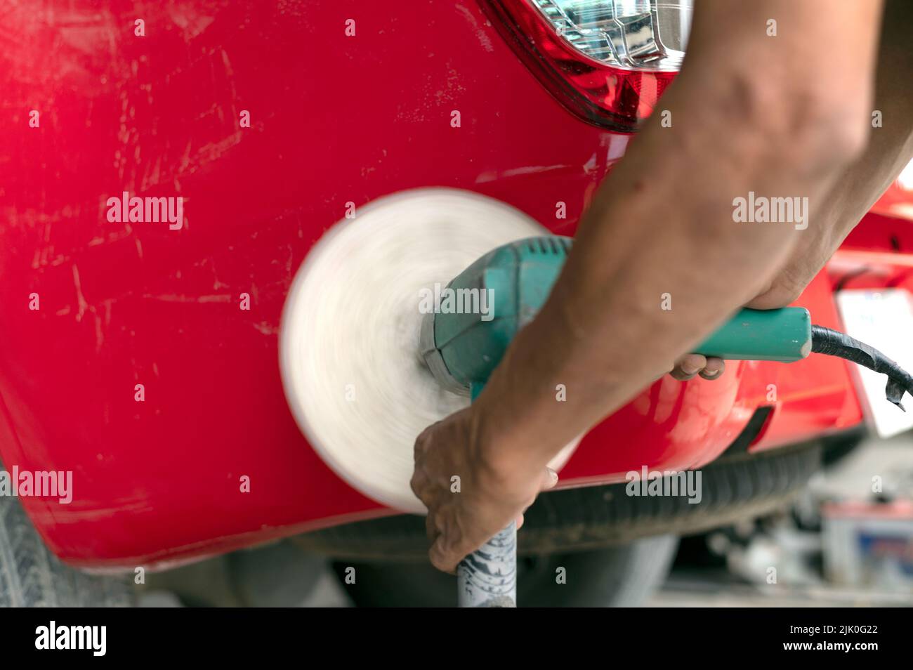 Closeup body repair tool for removing scratches, removing uneven paint and polishing cars Stock