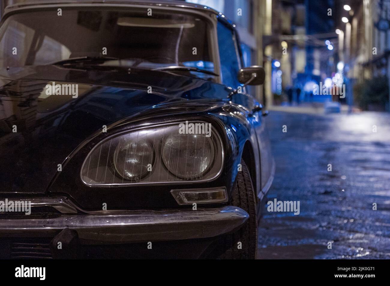 A front view shot of a Citroen Pallas car in the street at night Stock Photo