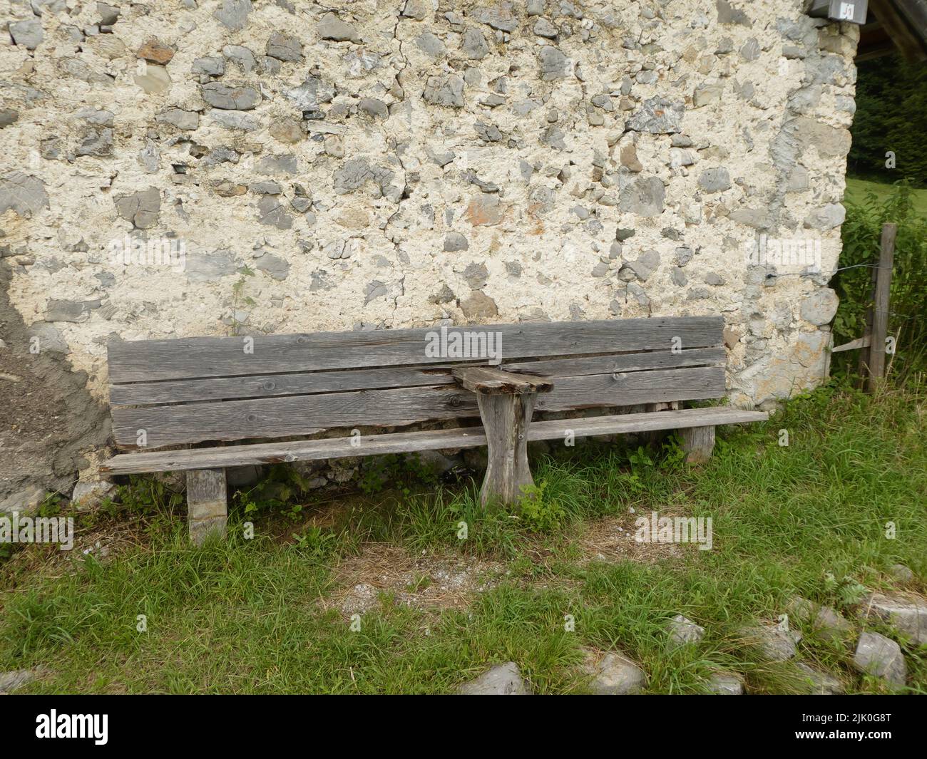 Wooden bench invites to a rest Stock Photo