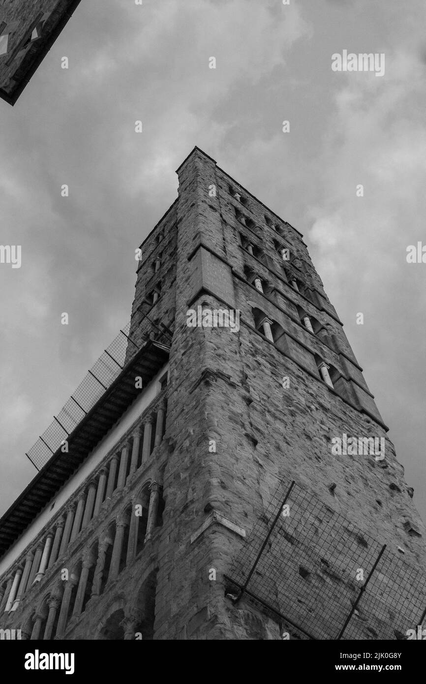 A grayscale low angle shot of the Bell tower Corso Italia Chiesa di Santa Maria della Pieve Stock Photo