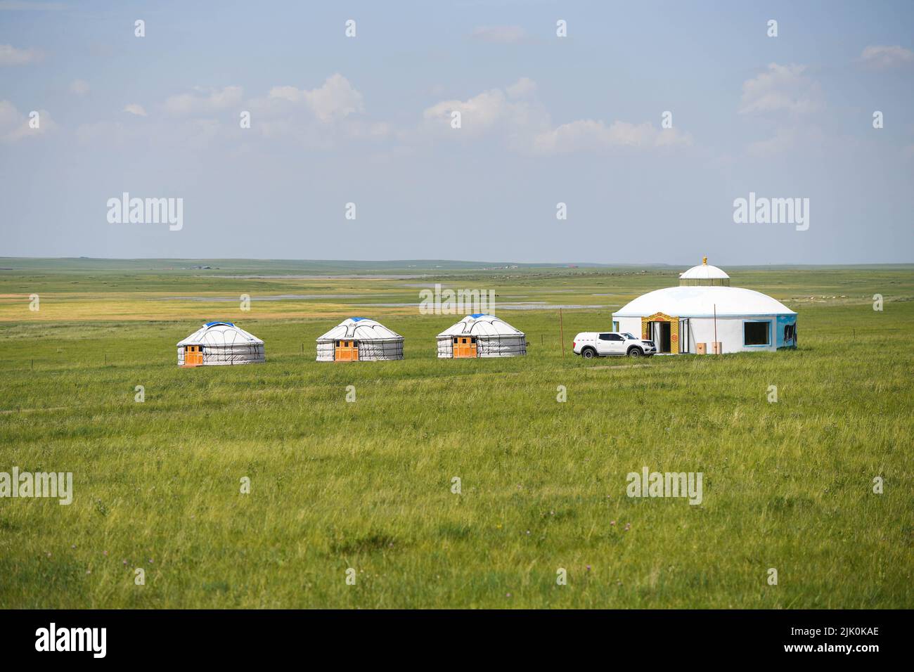 Xilingol. 27th July, 2022. Photo taken on July 27, 2022 shows Mongolian yurts on a grassland in East Ujimqin Banner of Xilingol League, north China's Inner Mongolia Autonomous Region. Credit: Liu Lei/Xinhua/Alamy Live News Stock Photo