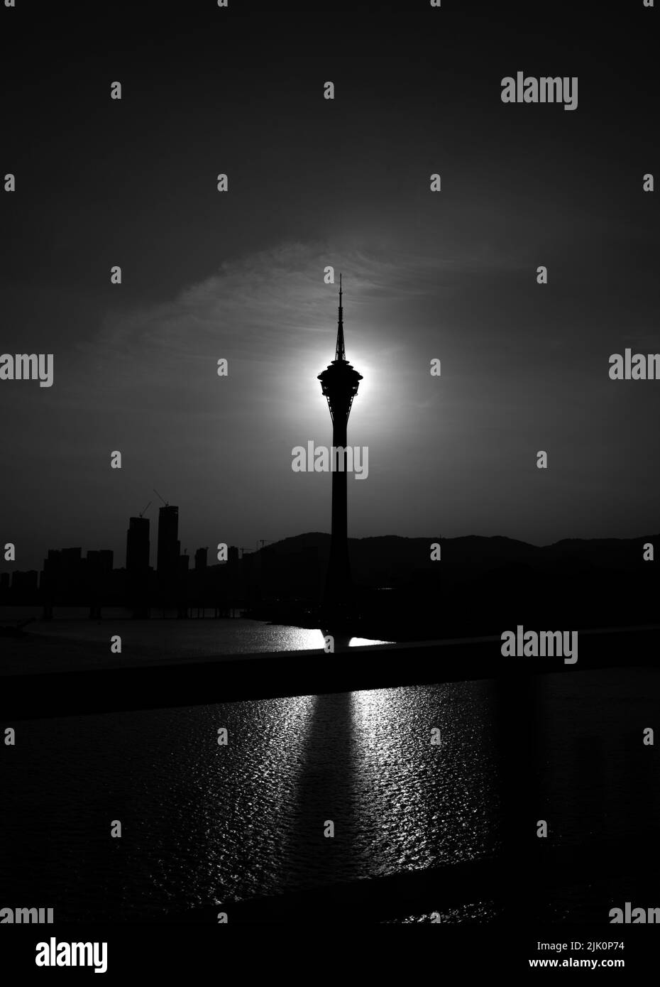 A breathtaking view of the silhouette of Milad Tower against dark cloudy night sky Stock Photo