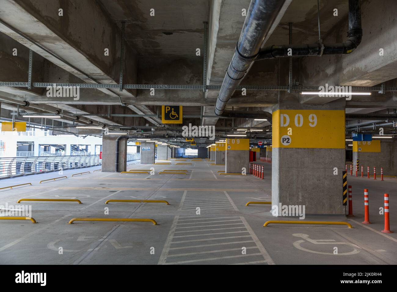 Indoor parking space with wheelchair signs for reserved parking at