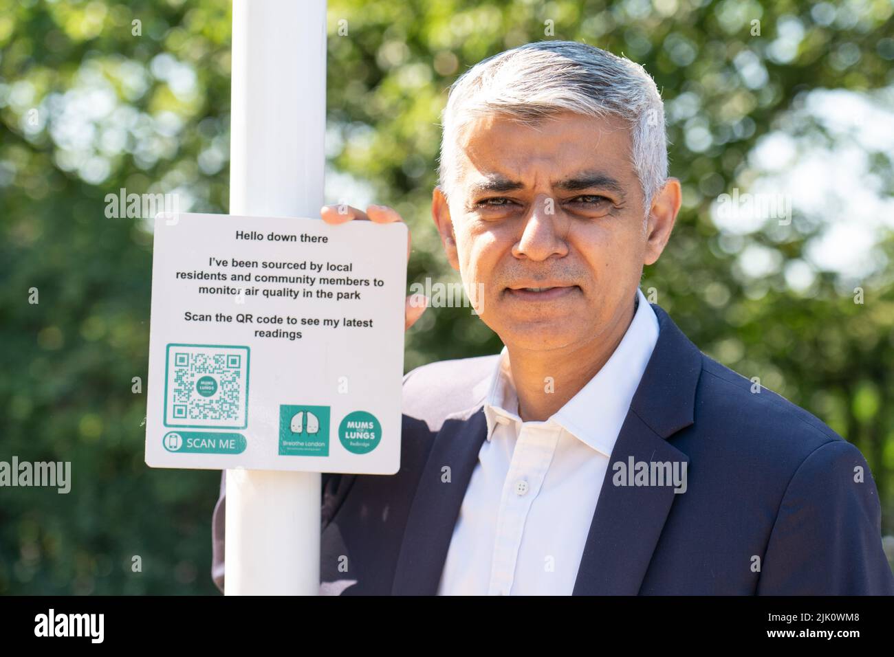 Mayor of London Sadiq Khan with an air quality monitoring station sign during a visit to Mums for Lungs community group in South Woodford, London, to coincide with the final day of the ULEZ expansion consultation and the publishing of new air quality data. Picture date: Friday July 29, 2022. Stock Photo