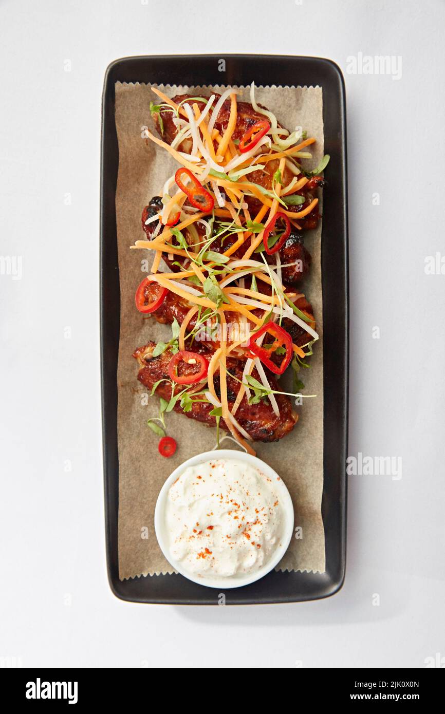 Spicy chicken wings with dip Stock Photo