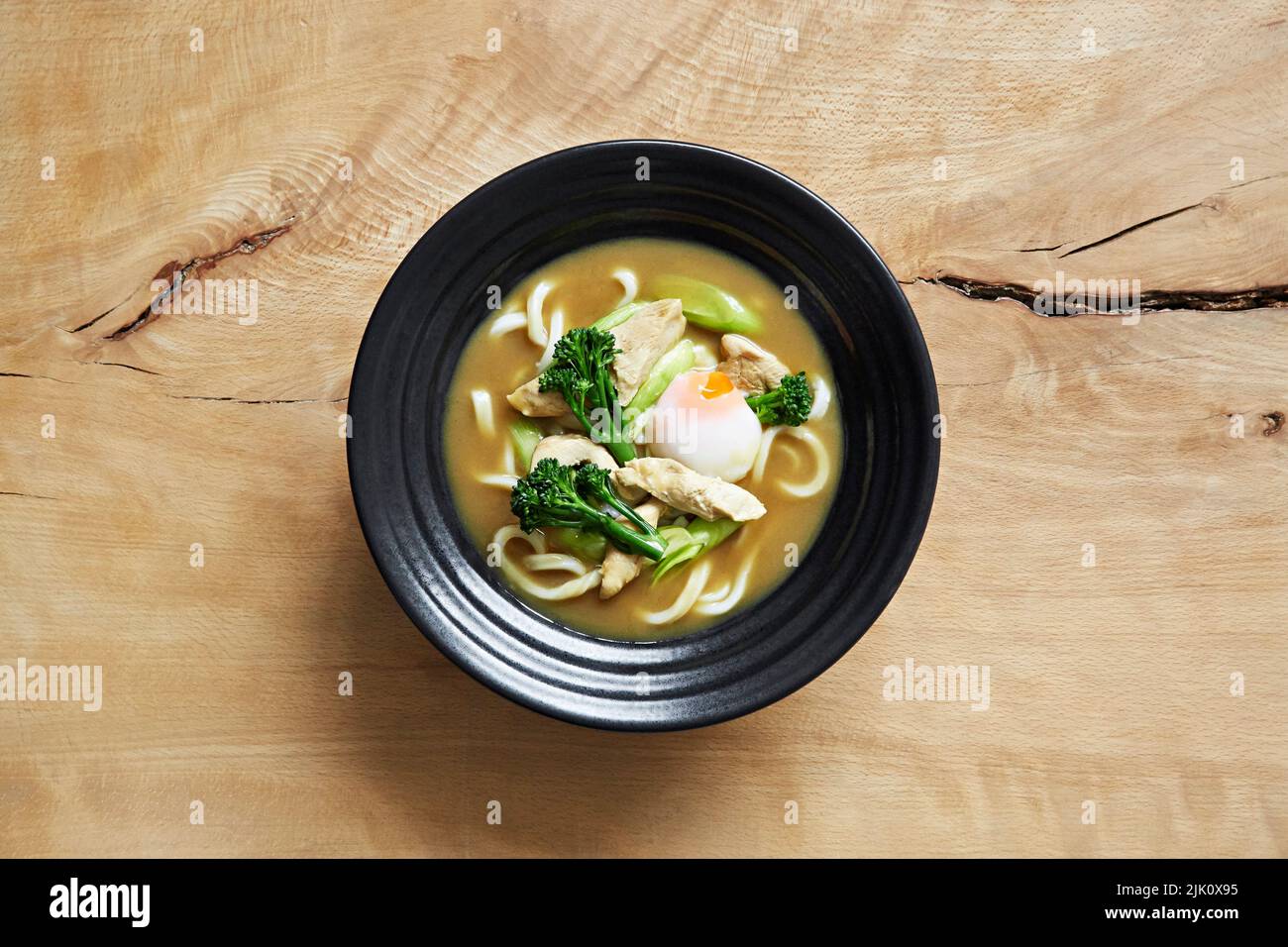 Ramen with udon noodles, chicken, broccoli and spring onion Stock Photo