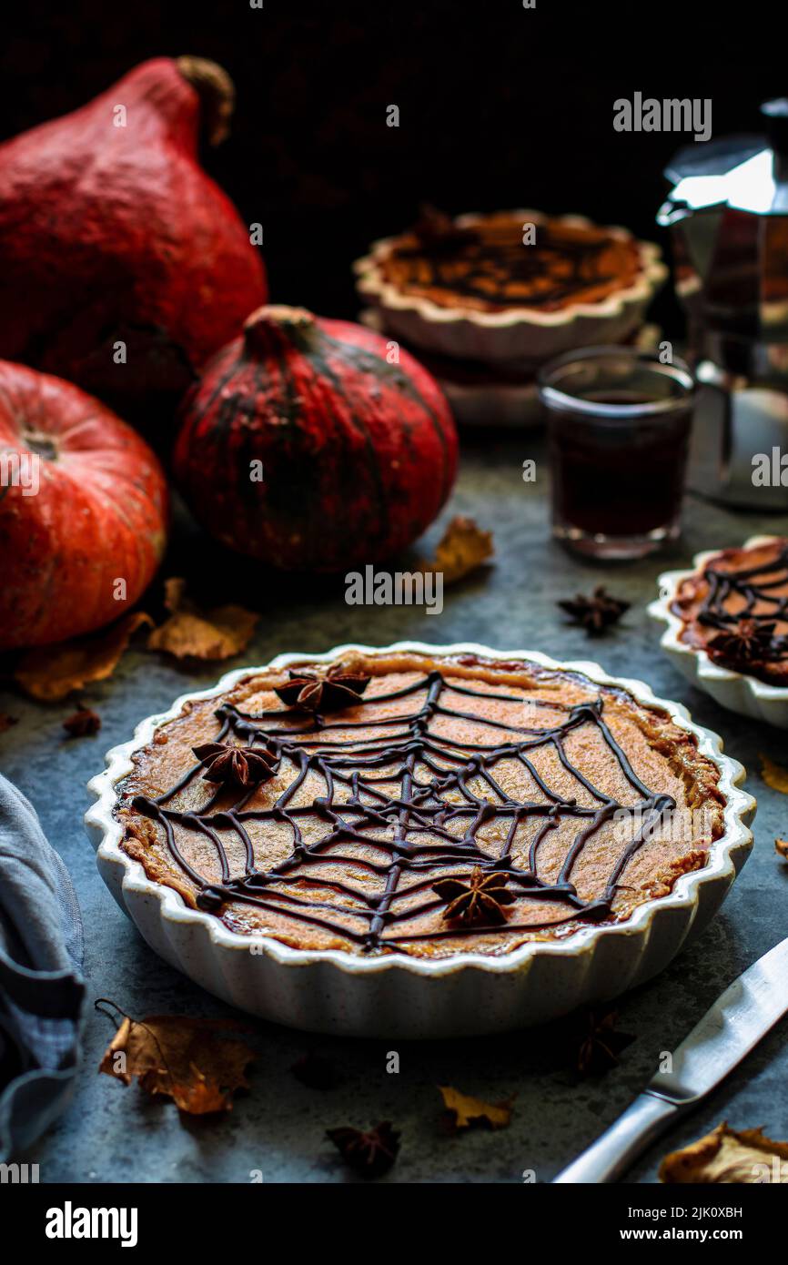 Pumpkin pie with spider web decorations Stock Photo