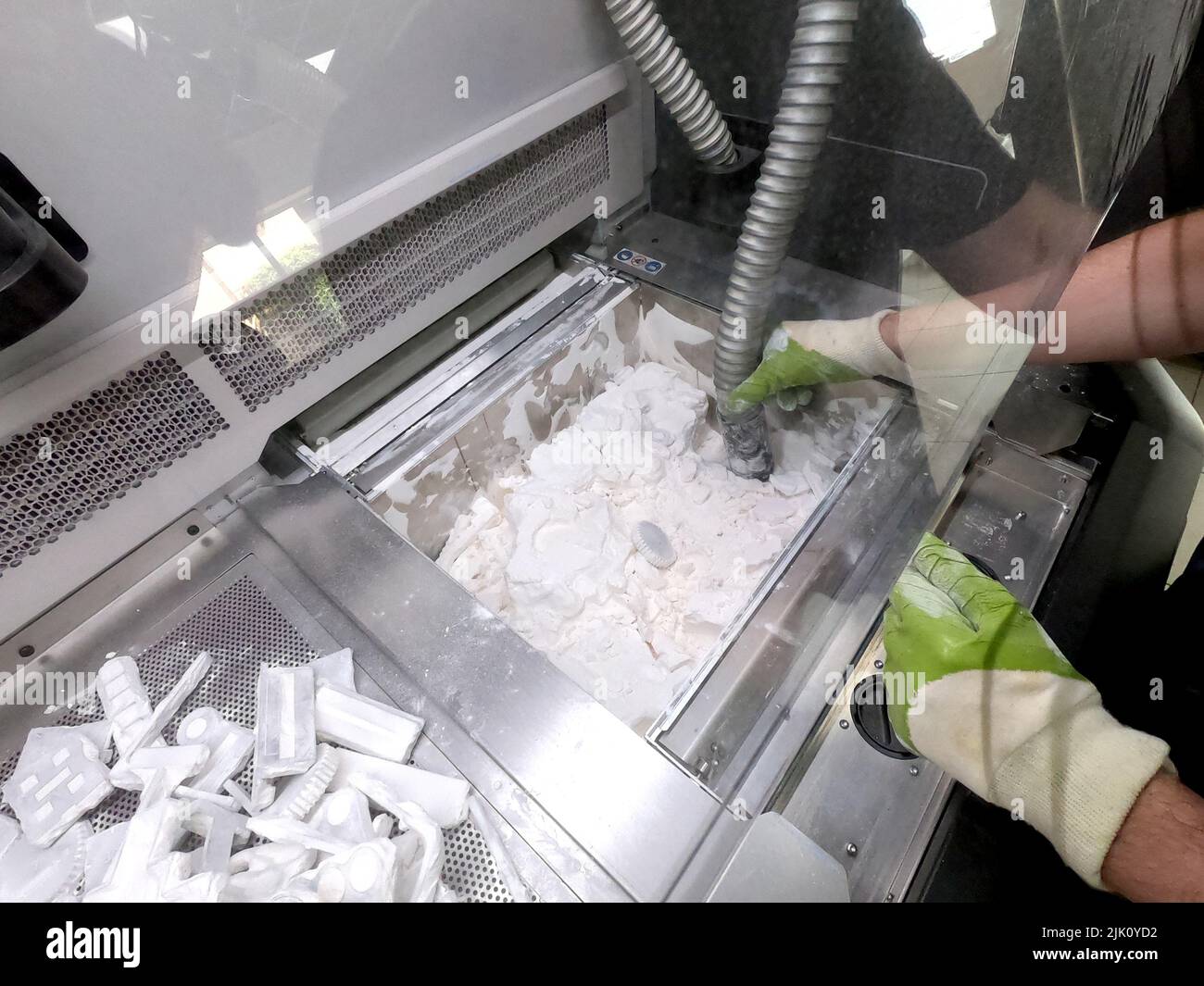 Engineer or artist designer printing 3D parts and shaping models from