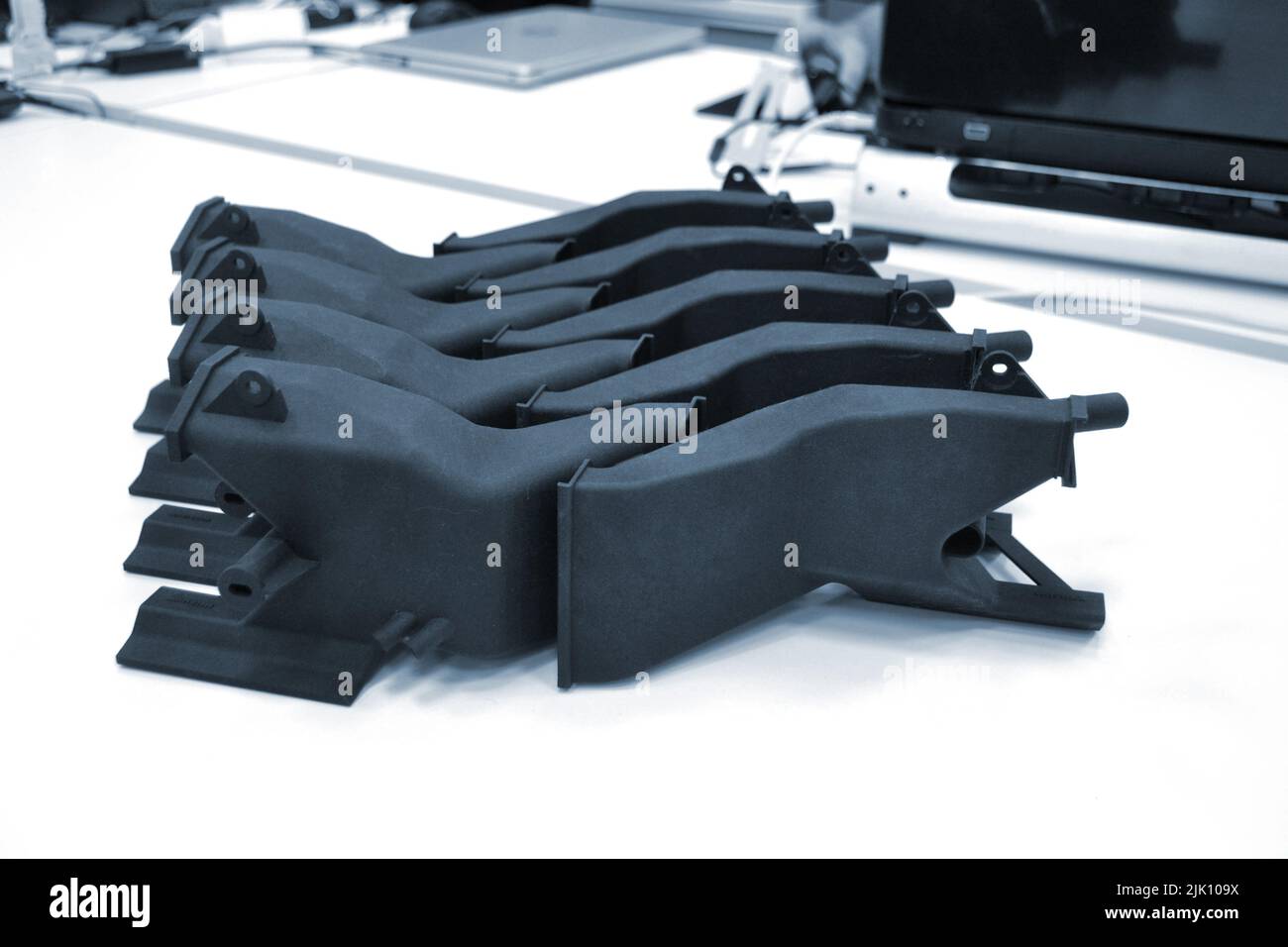 Black model printed on 3D printer in laboratory office. Object printed ...