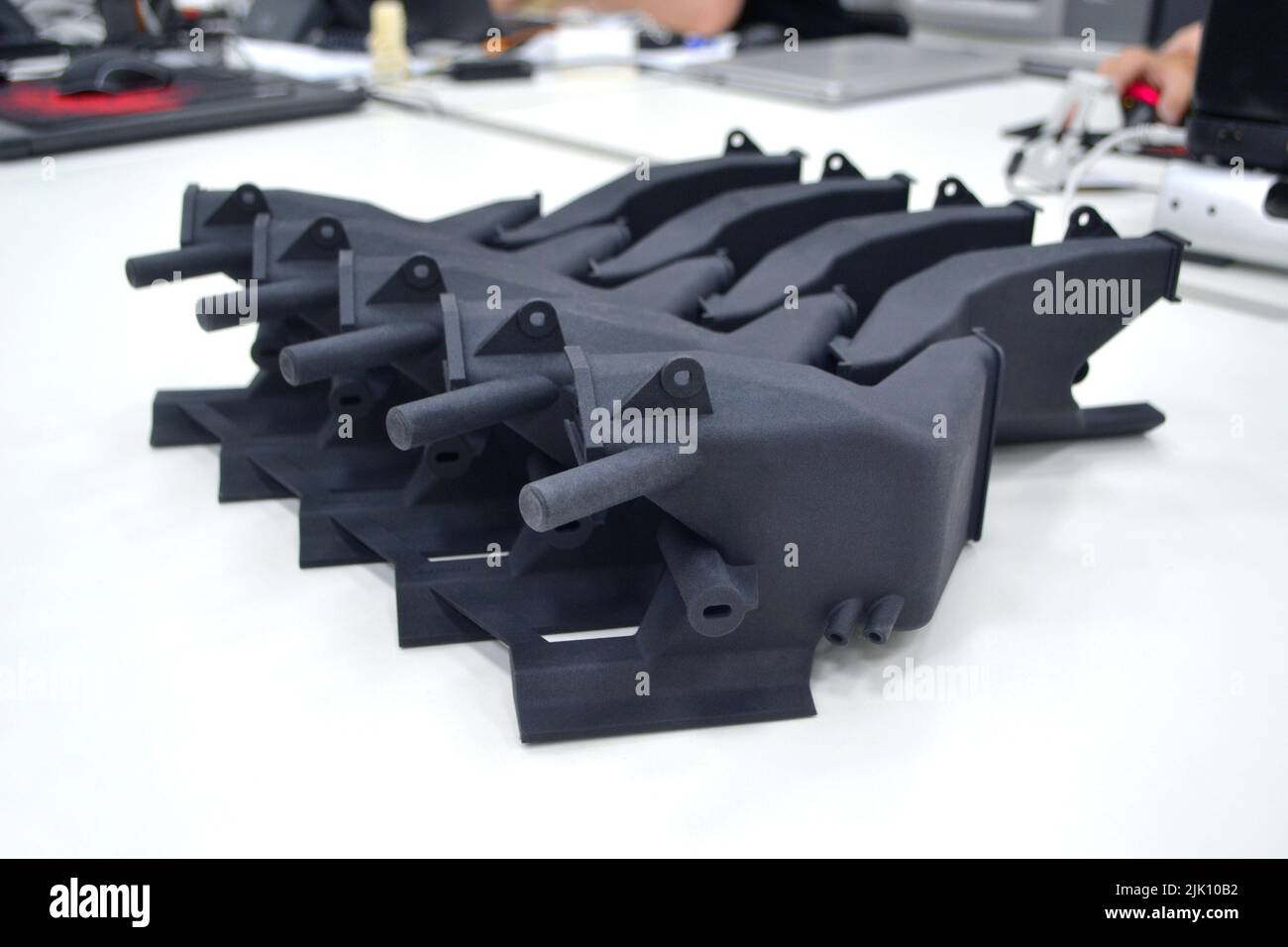 Black model printed on 3D printer in laboratory office. Object printed ...
