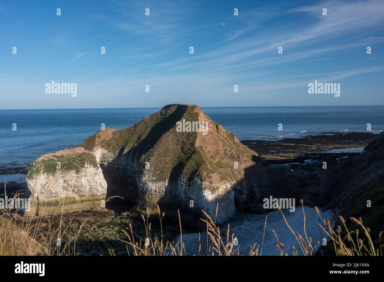 Flamborough Head.  promontory is a raised mass of land that projects into a lowland or a body of water 8 miles long on the East Yorkshire coast. Stock Photo