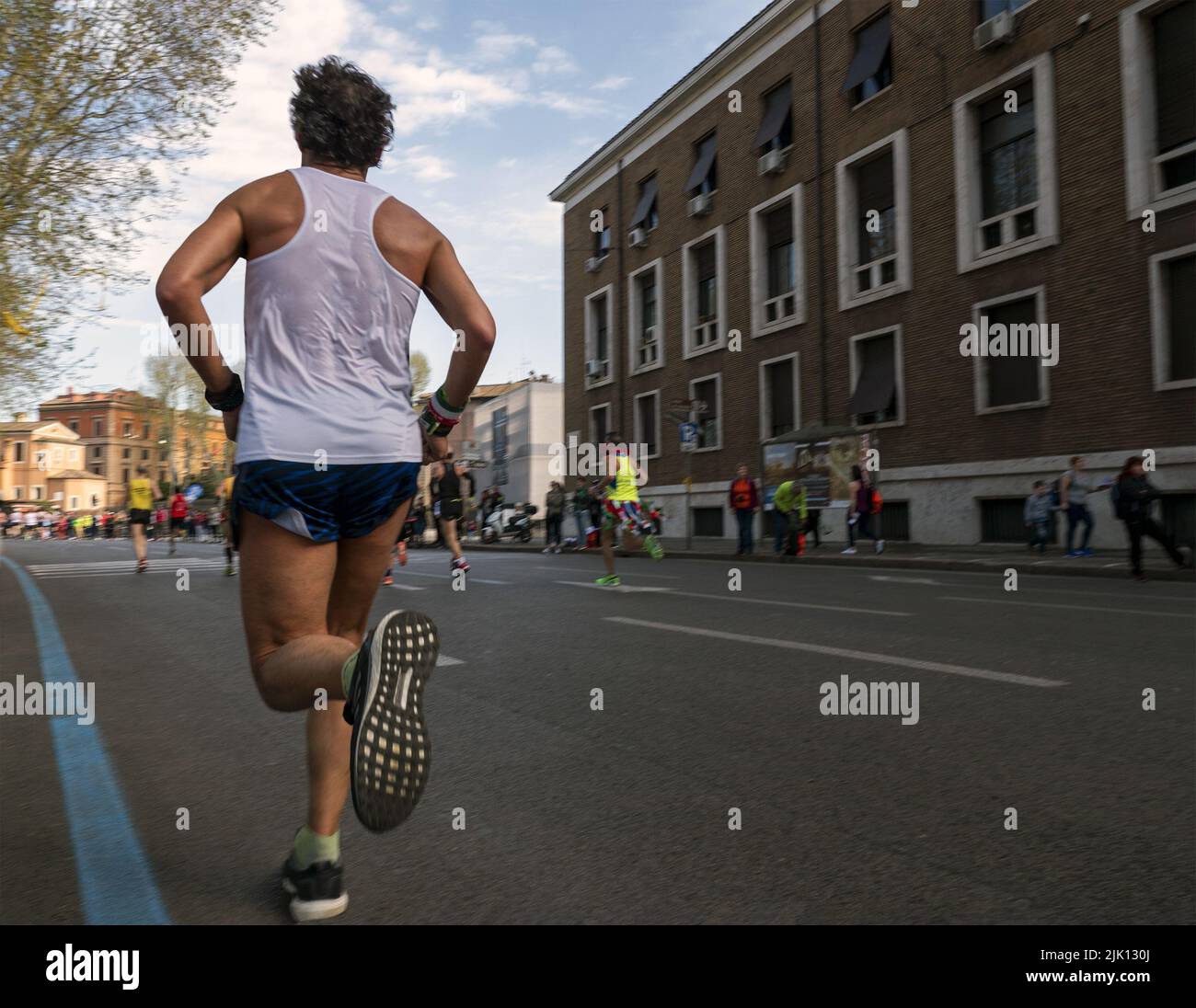 male runner running marathon race in rome Stock Photo