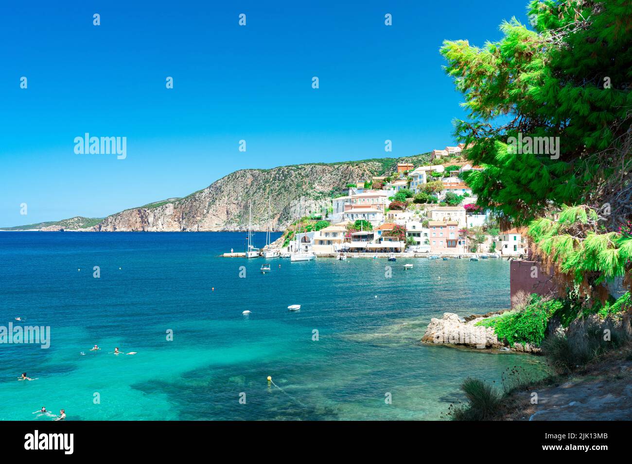 Small village and harbor of Assos overlooking the turquoise blue sea, Kefalonia, Ionian Islands, Greek Islands, Greece, Europe Stock Photo