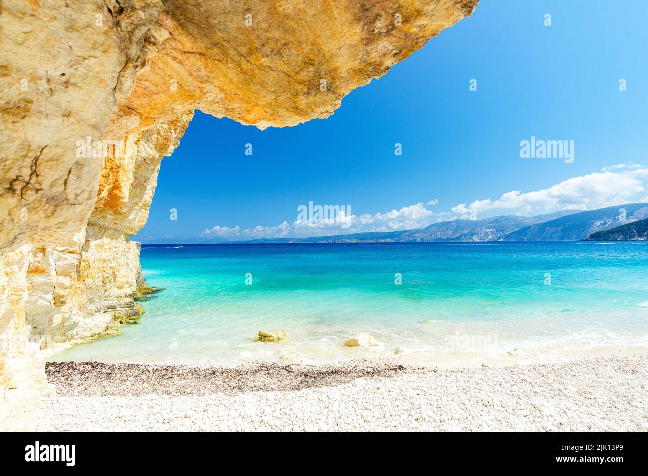 Crystal sea surrounded by limestone cliffs and white pebbles, Fteri Beach, Kefalonia, Ionian Islands, Greek Islands, Greece, Europe Stock Photo