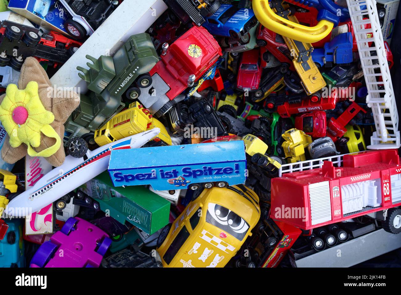 Various plastic toys (cars & trucks) at the flea market in Hanover (No. 45) Stock Photo