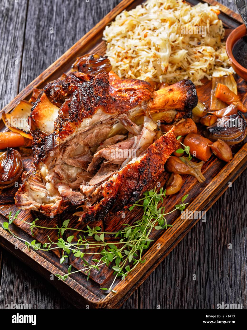 Crispy German Pork Knuckle, roast ham hock, Schweinshaxe, with Beer