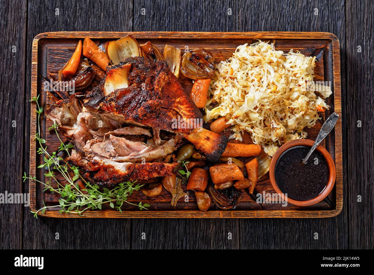 Crispy German Pork Knuckle, roast ham hock, Schweinshaxe, with Beer