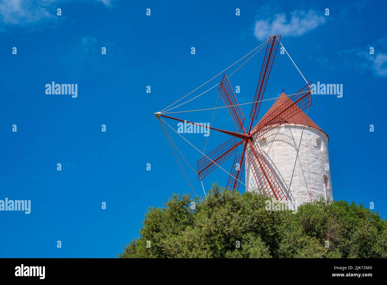 View of windmill against blue sky in Es Mercadal, Menorca, Balearic Islands, Spain, Mediterranean, Europe Stock Photo