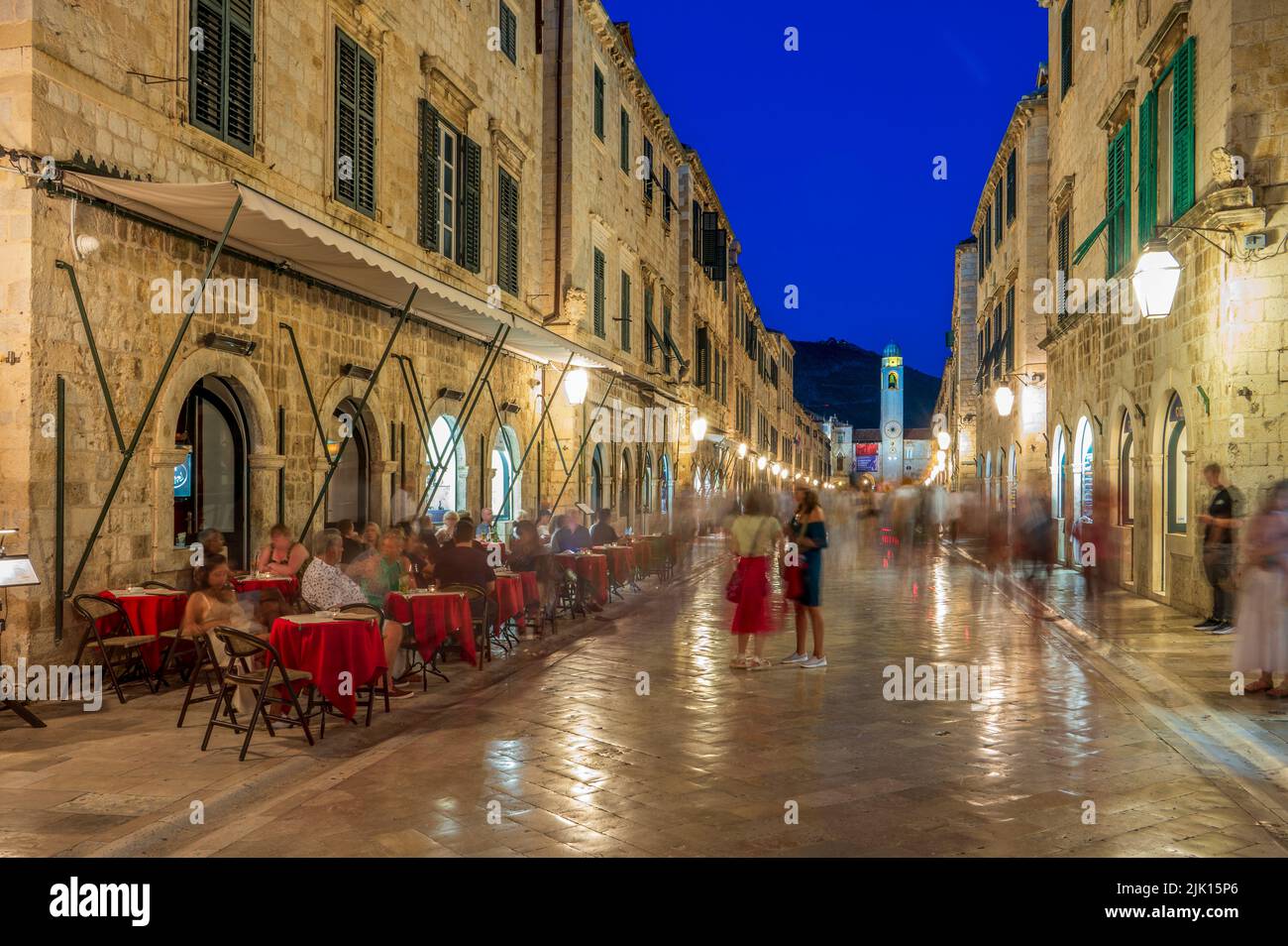 People eating at outdoor restaurant at dusk in the old town, UNESCO World Heritage Site, Dubrovnik, Croatia, Europe Stock Photo