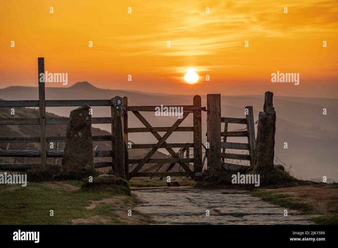 The Great Ridge gate with view of Win Hill at sunrise, Edale, Peak District, Derbyshire, England, United Kingdom, Europe Stock Photo