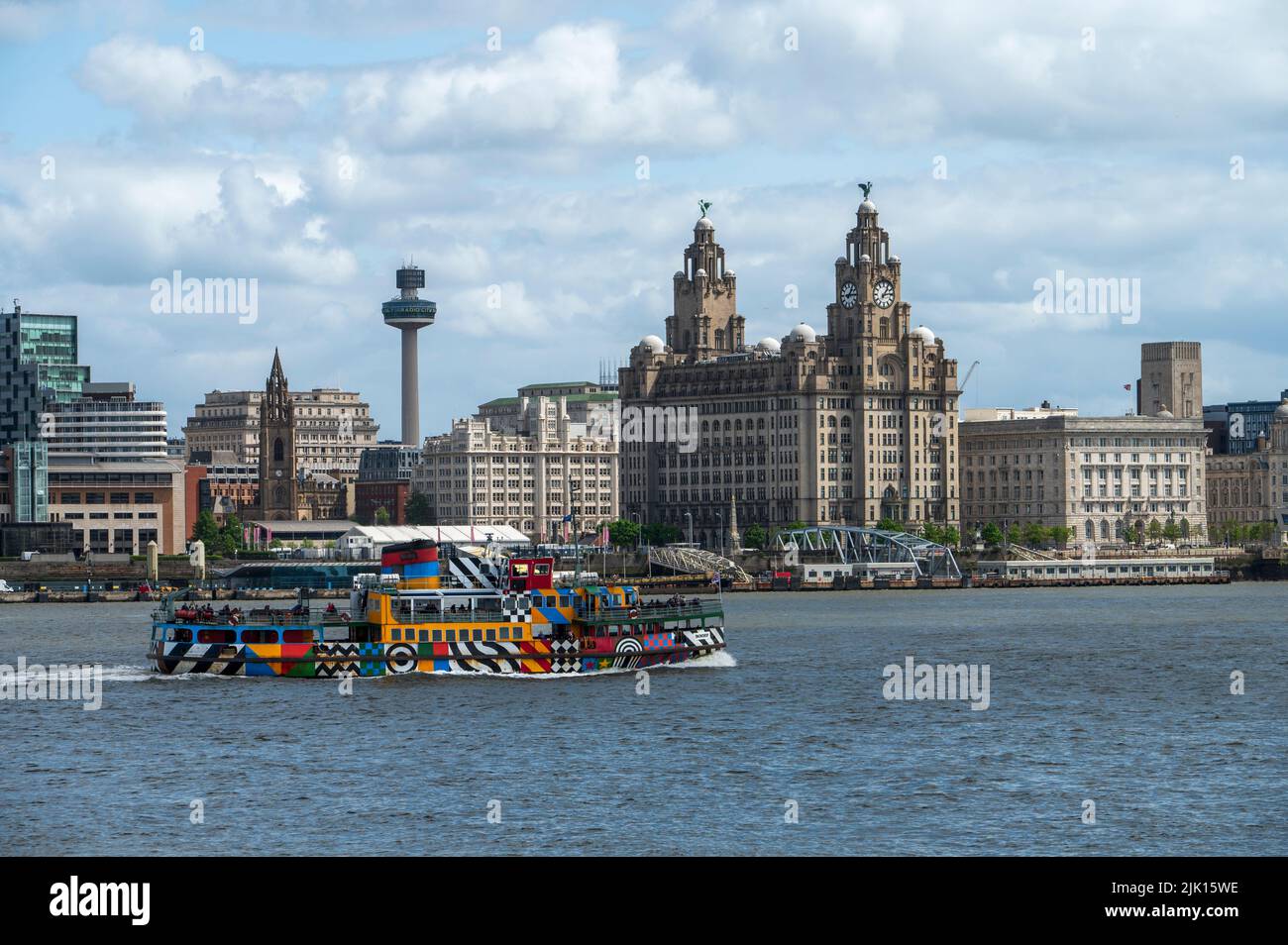 The Mersey ferry Snowdrop sailing in front of the Liverpool Waterfront, Liverpool, Merseyside, England, United Kingdom, Europe Stock Photo