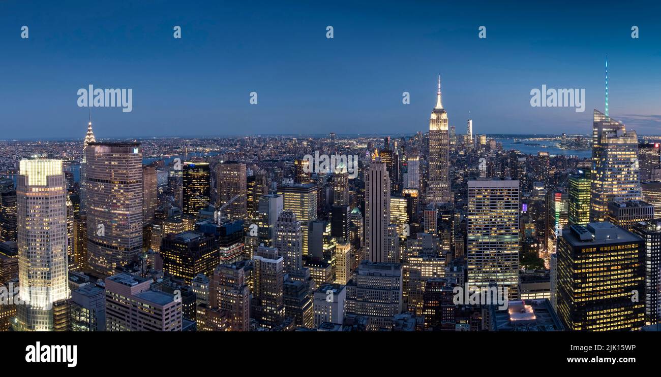 Panoramic image of the Manhattan city skyline and the Empire State Building at night, Manhattan, New York, United States of America, North America Stock Photo