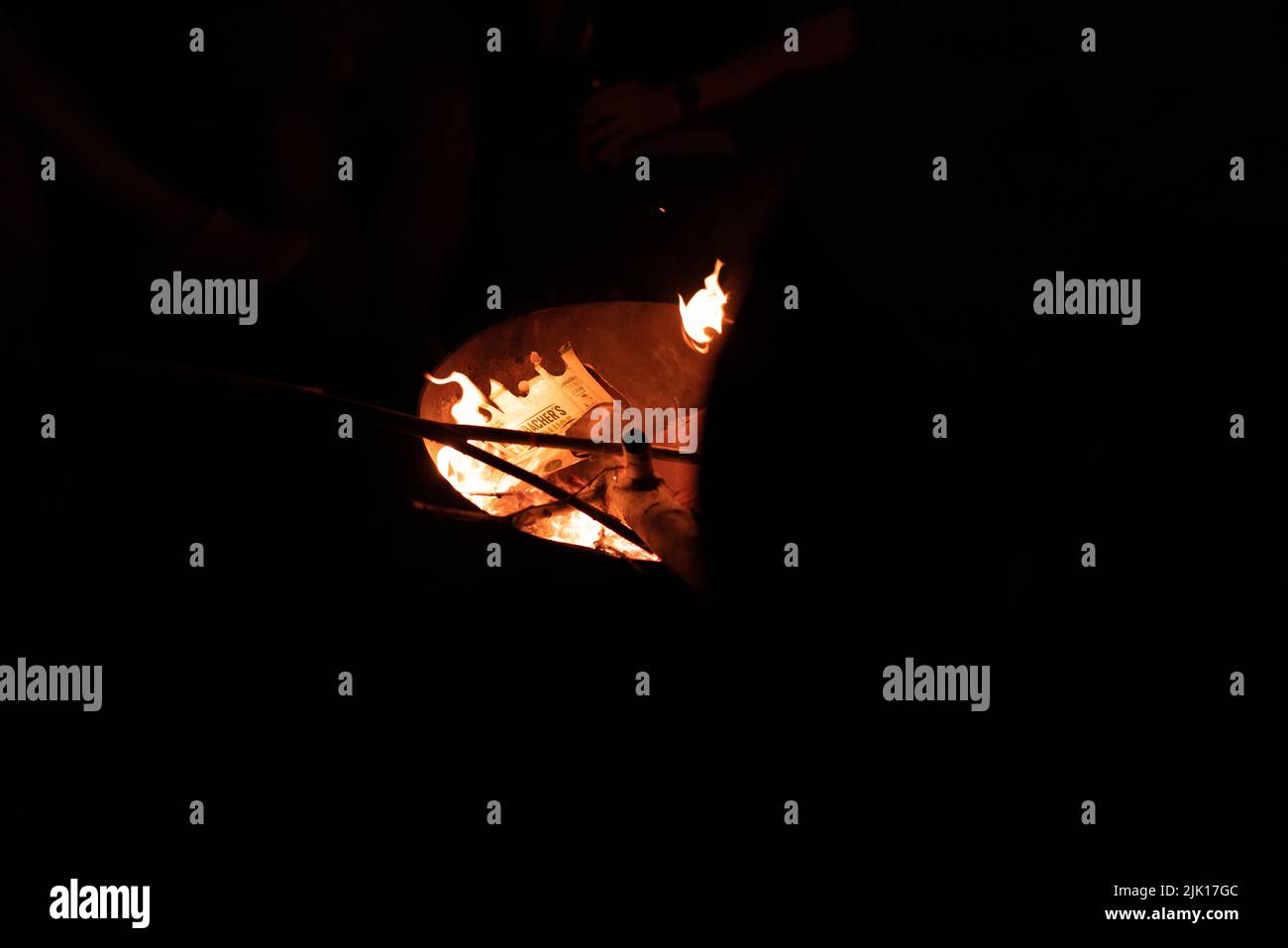 A closeup shot of a big bonfire with orange flames in the dark Stock ...