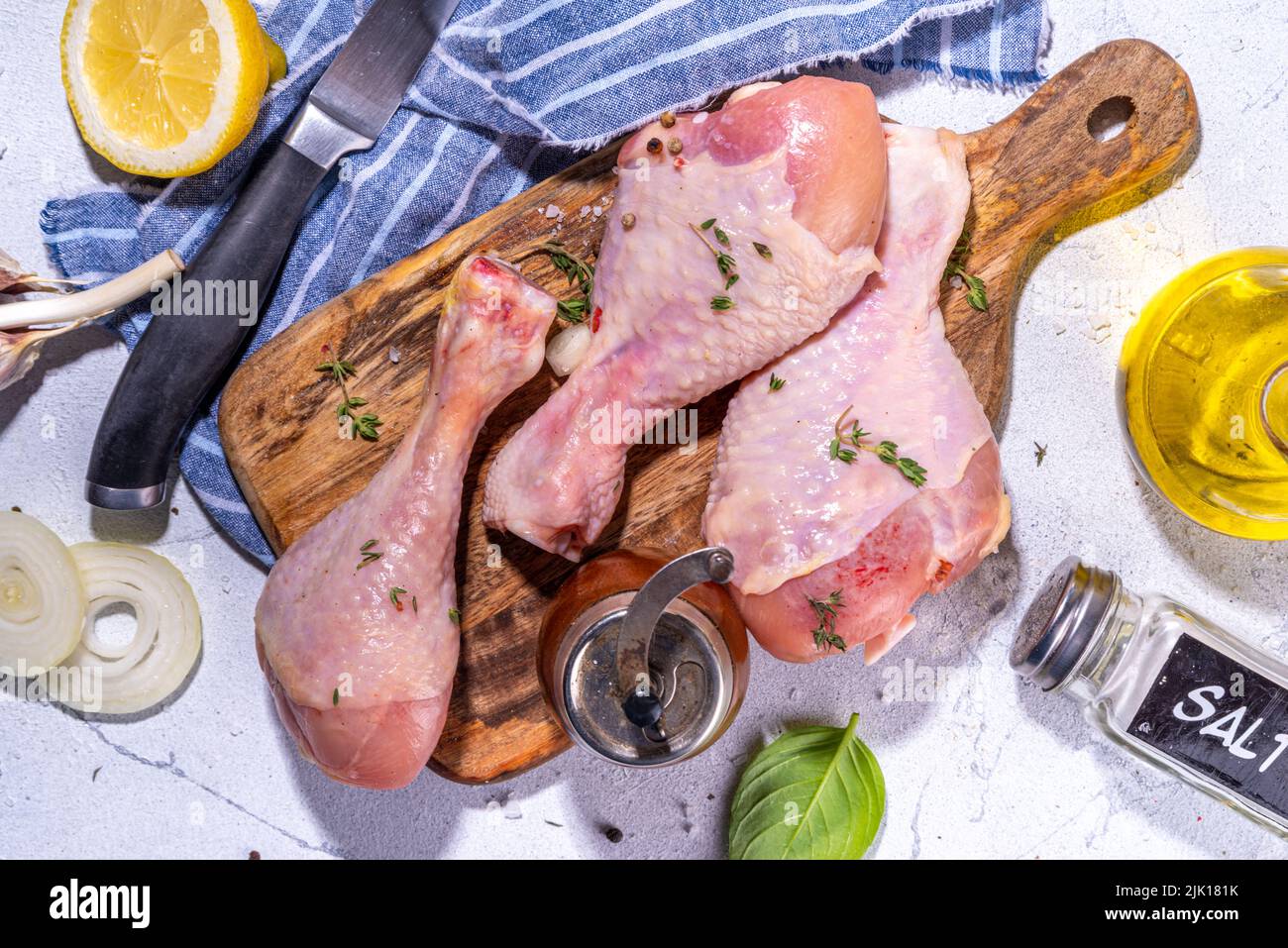Raw chicken drumsticks with spices for cooking. Raw chicken drumsticks