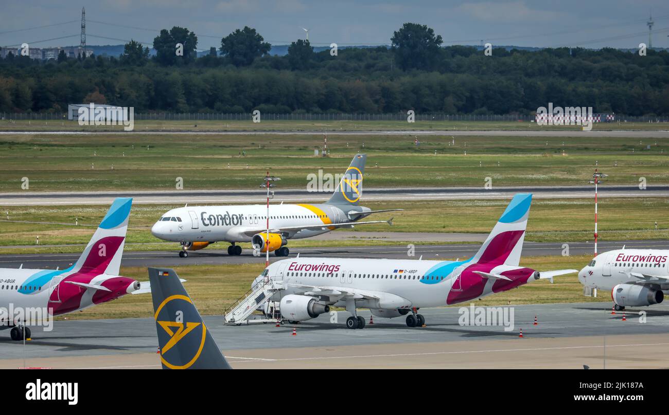 Duesseldorf, North Rhine-Westphalia, Germany - Duesseldorf Airport, aircraft of the airlines Eurowings and Condor in parking position on the day of th Stock Photo