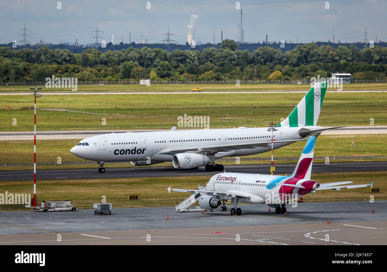 Duesseldorf, North Rhine-Westphalia, Germany - Duesseldorf Airport, aircraft of the airlines Eurowings, and Condor on the day of the warning strike by Stock Photo