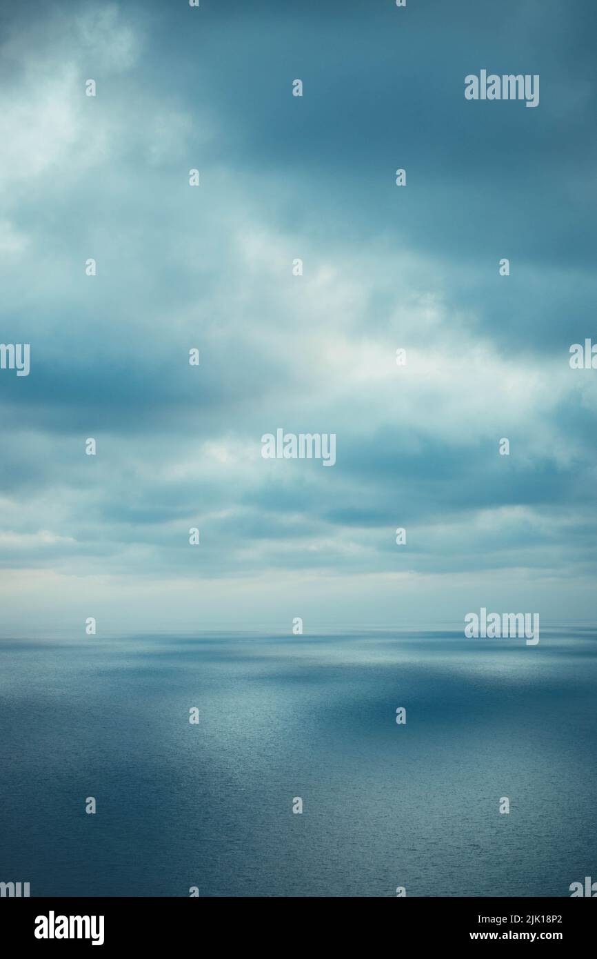 A Vertical Shot Of A Gloomy Sky Over A Blue Sea Stock Photo Alamy a-vertical-shot-of-a-gloomy-sky-over-a-blue-sea-stock-photo-alamy
