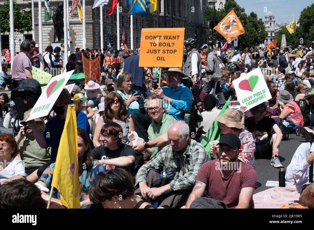 On July 23rd 2022 a number of climate and social justice activists met up in small swarms all over London and these then converged on Parliament Squar Stock Photo