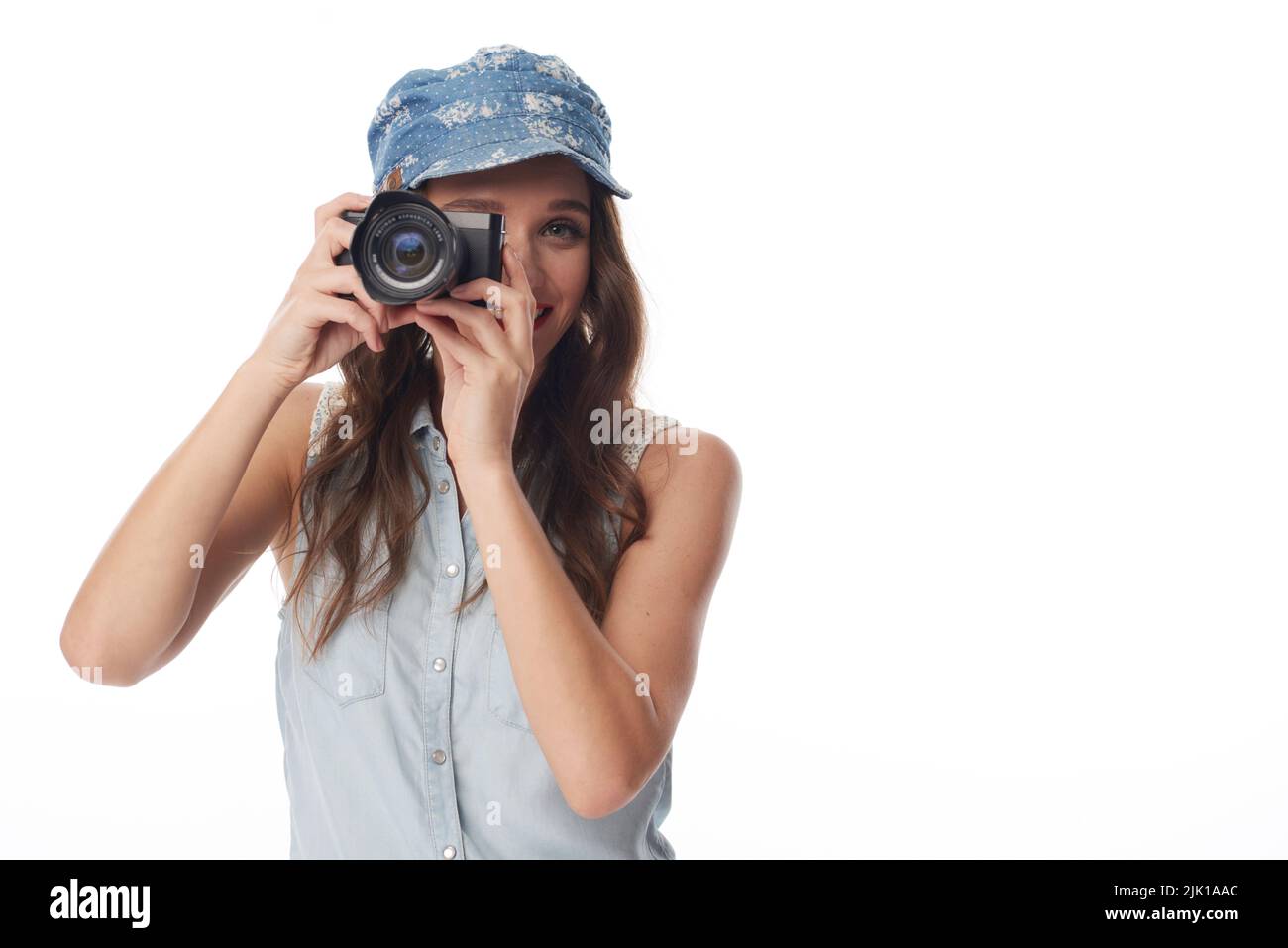 Cheerful pretty female photographer with digital camera Stock Photo