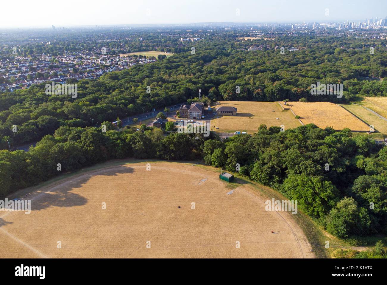 Aerial view looking over Thames Water Woodford Pumping Station into London on a sunny morning. London Stock Photo