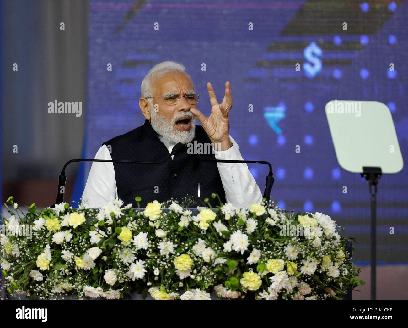 Prime Minister Narendra Modi gestures as he delivers a speech after he inaugurated India International Bullion Exchange (IIBX), India's first international bullion exchange, at Gujarat International Finance Tec-City, or GIFT City in Gandhinagar, India, July 29, 2022. REUTERS/Amit Dave Stock Photo
