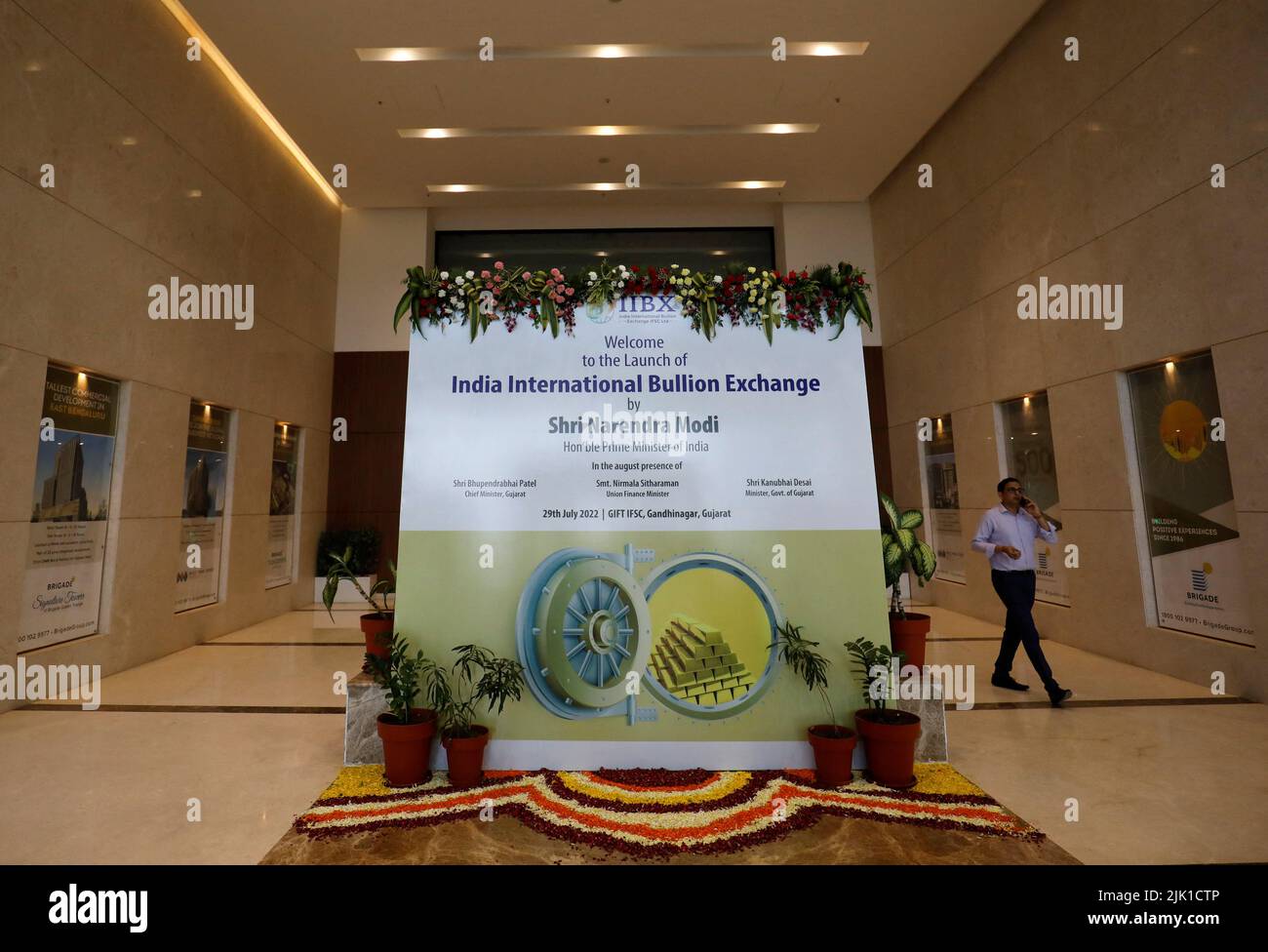 An official walks inside after the inauguration of India International Bullion Exchange (IIBX), India's first international bullion exchange, at Gujarat International Finance Tec-City, or GIFT City in Gandhinagar, India, July 29, 2022. REUTERS/Amit Dave Stock Photo