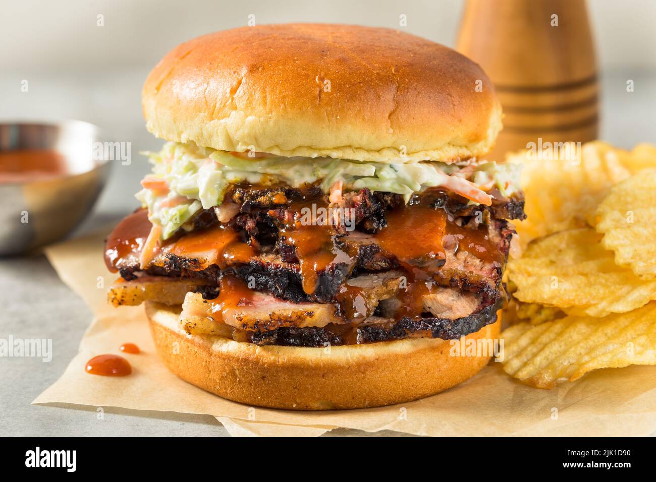 Homemade Chopped Brisket Sandwich with BBQ Sauce and Chips Stock Photo