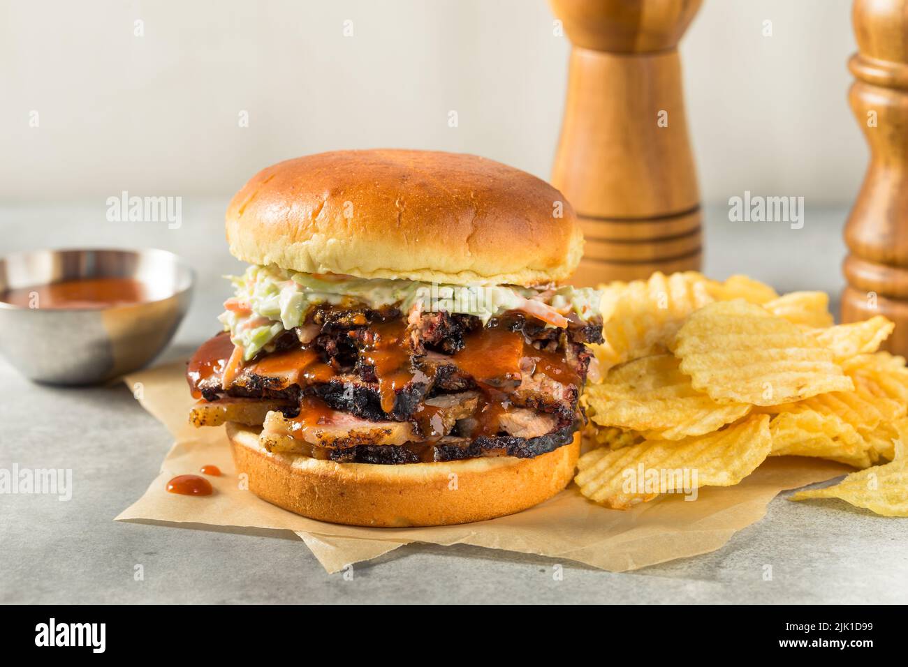 Homemade Chopped Brisket Sandwich with BBQ Sauce and Chips Stock Photo