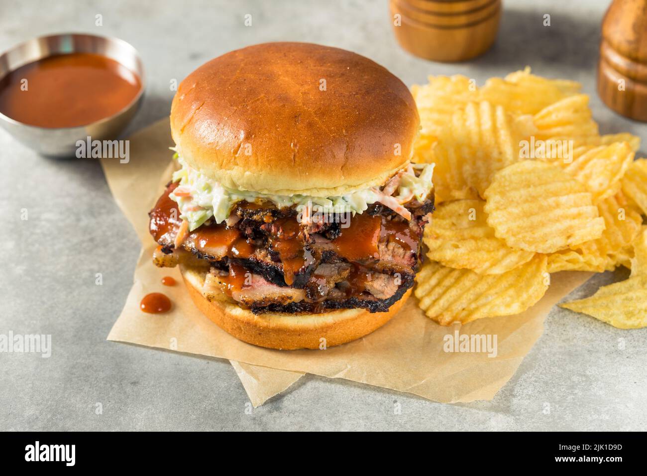 Homemade Chopped Brisket Sandwich with BBQ Sauce and Chips Stock Photo