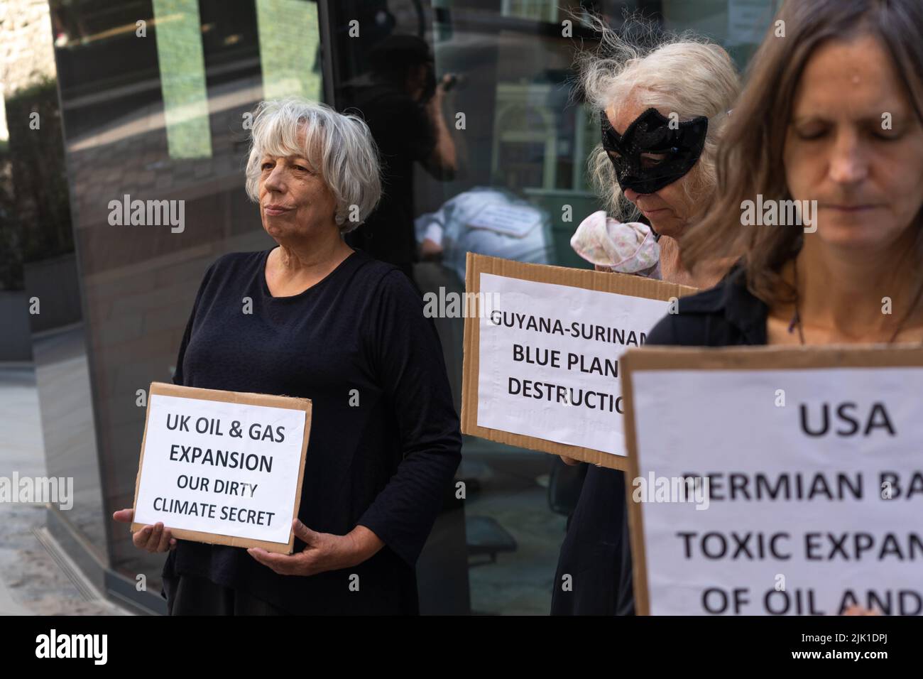 London, England, UK 29 July 2022 Members of Extinction Rebellion elders and grandparents perform Burning Ballroom and die in, outside Vanguard offices in protest at their investment in 'Carbon Bomb' projects across the world Stock Photo