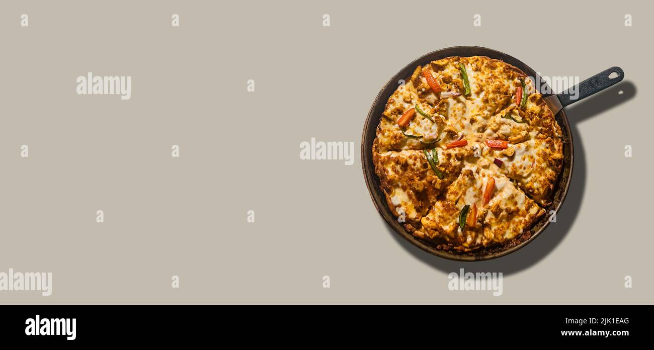 Isolated pan of delicious Pizza with grey banner template. Stock Photo