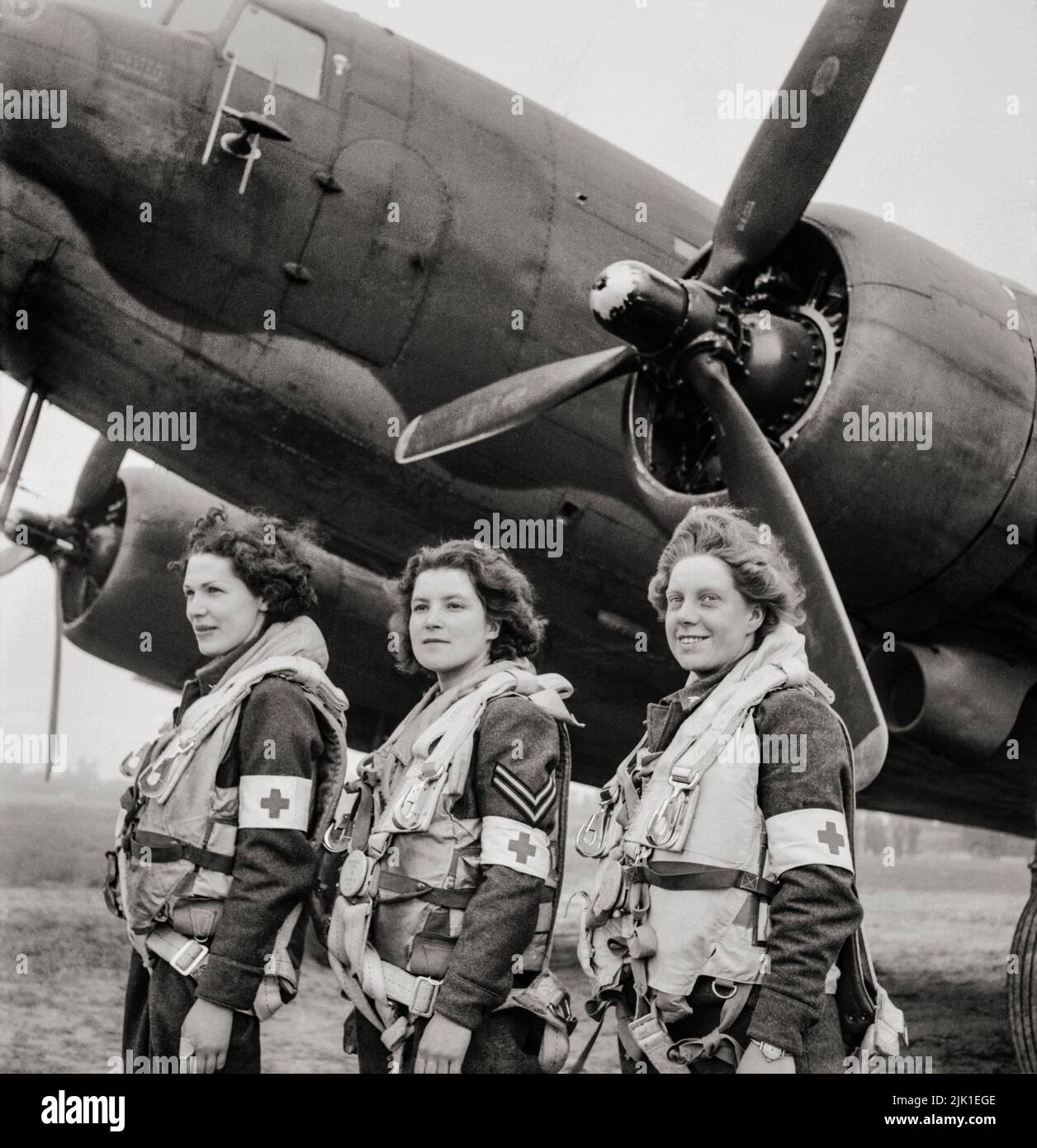 The first WAAF nursing orderlies selected to fly on air-ambulance duties to France, standing in front of a Douglas Dakota Mark III of No. 233 Squadron RAF at B2/Bazenville, Normandy. From left to right: Leading Aircraftwoman Myra Roberts of Oswestry, Corporal Lydia Alford of Eastleigh and Leading Aircraftwoman Edna Birbeck of Wellingborough'. Stock Photo