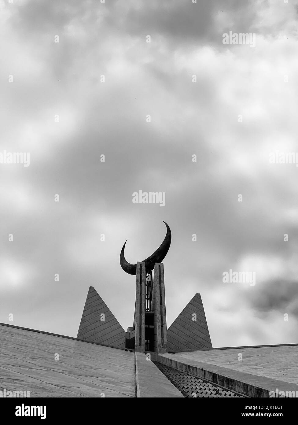 Closeup view of Islamic mosque architect with moon and clouds. Stock Photo