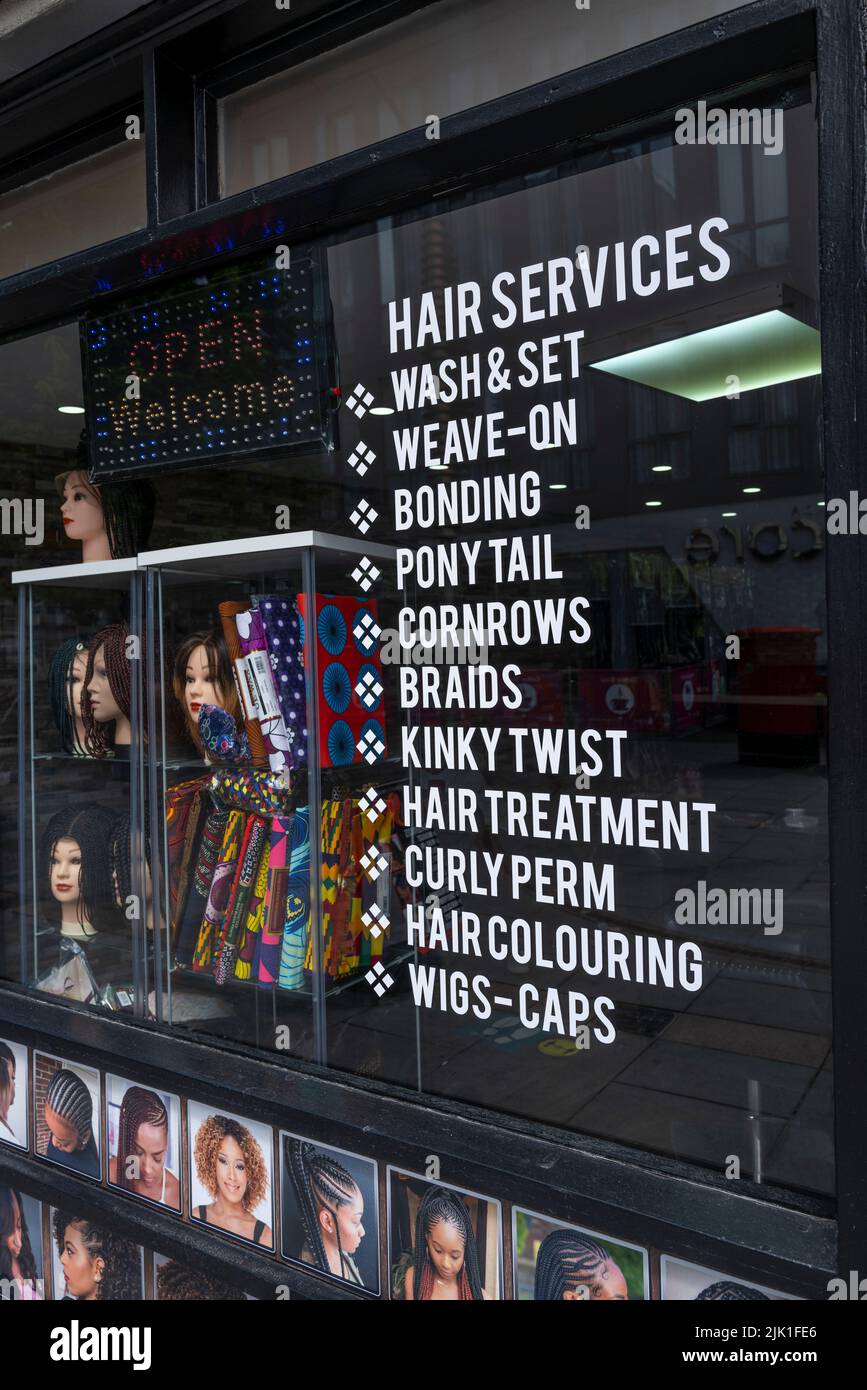 The window of a ladies hair salon. Stock Photo