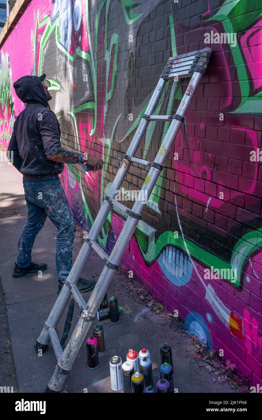A graffiti arist in Leicester Graffiti Festival 2022. Stock Photo