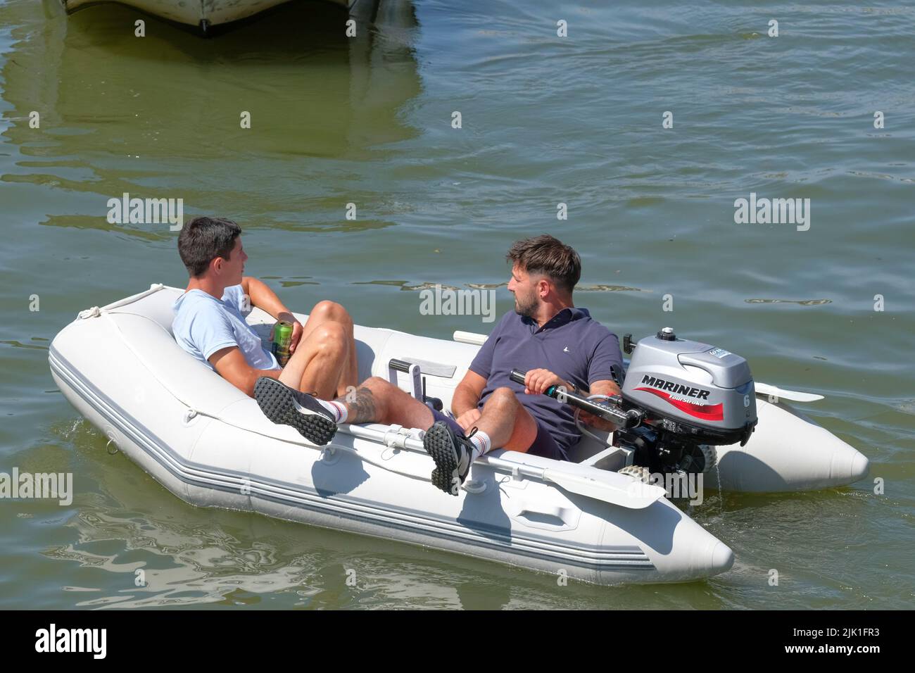 Two young men in a boat , Bristol Harbour. Bristol Harbour festival. Stock Photo