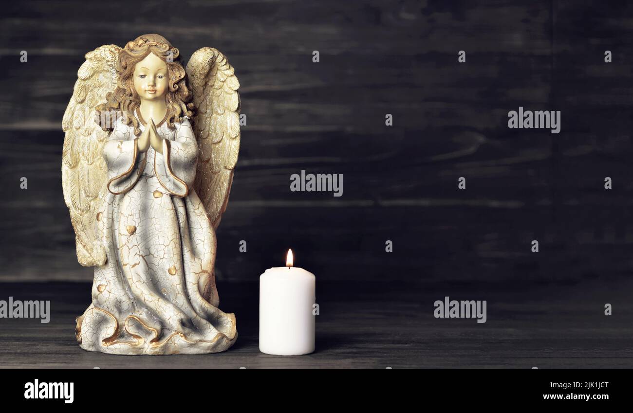 Condolence card with an angel and a burning candle Stock Photo