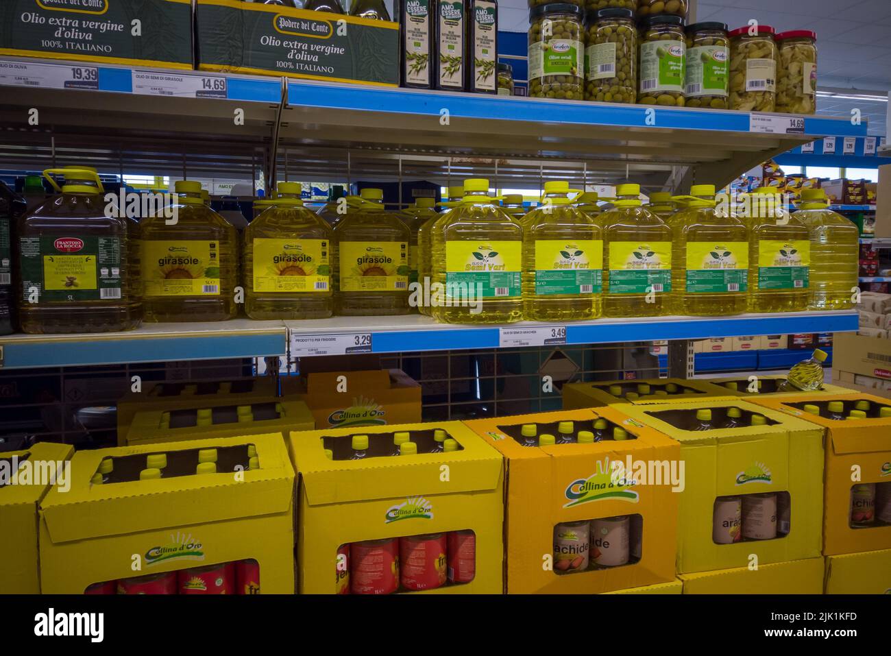 Fossano, Italy - July 29, 2022: large plastic bottles of various oils of seed and sunflower oil on Italian supermarket shelf. Tex: girasole (sunflower Stock Photo
