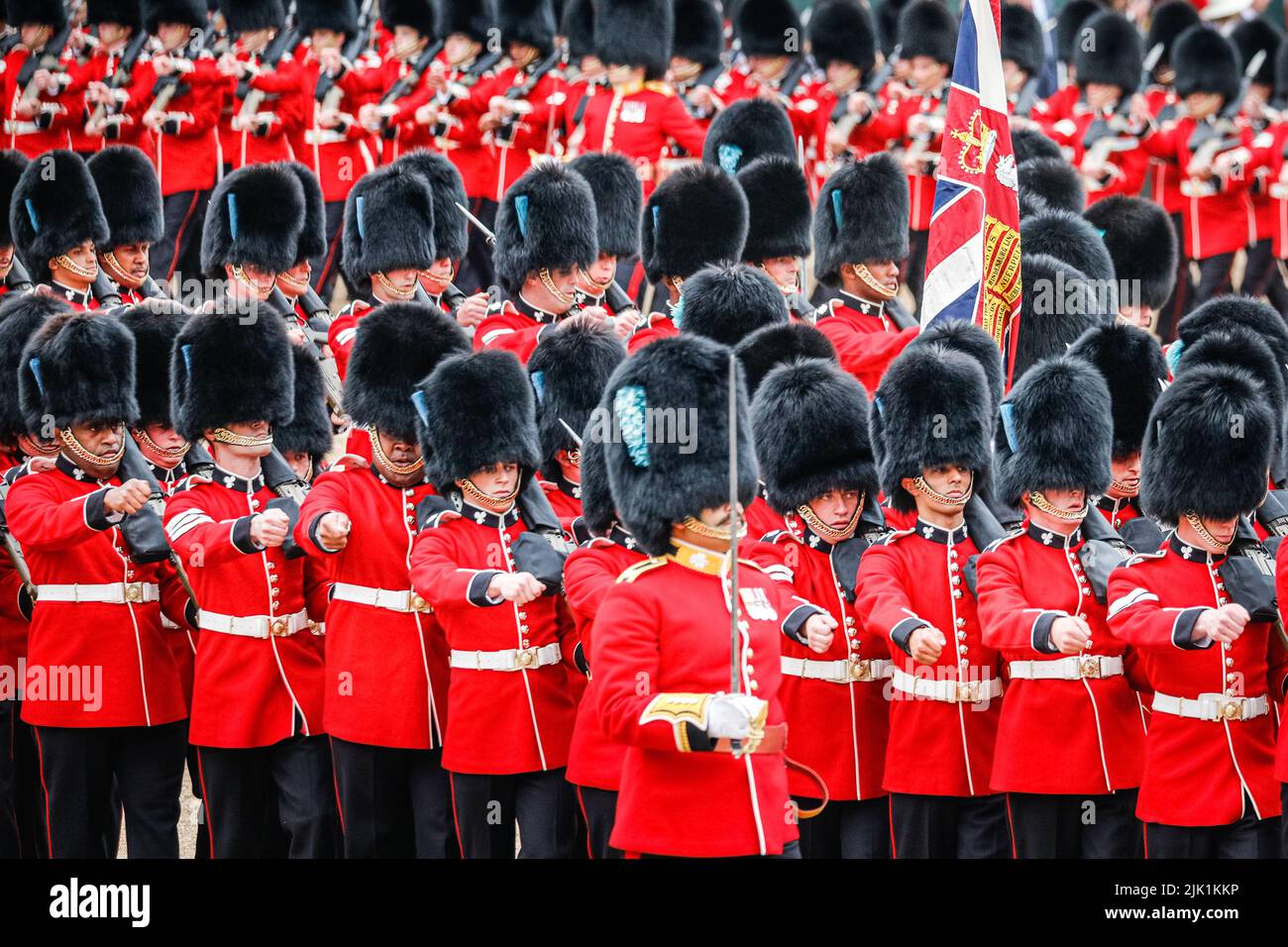 London, UK, 28th May 2022. The Colonel's Review of Trooping the Colour, guards in traditional red uniform and bear skin hat marching, London, England Stock Photo